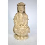 A blanc-de-chine style figure of Guanyin, the Bodhisattva of Mercy; seated in dhyanasana on a