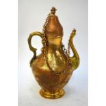 An Ottoman style metal ewer with screw top fixed with a chain; decorated with floral designs, 38