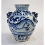 A modern, Chinese, blue and white dragon vase; designed with two animal head and fixed ring handles,