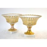 A pair of 19th century French Empire porcelain gilded reticulated garniture vases, 22 cm high (2)