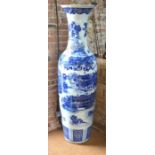 A tall, modern Japanese, or other Asian, blue and white vase with trumpet neck and four-character