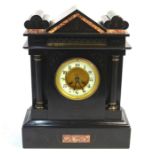 A late 19th century French slate 8-day mantle clock, the dial flanked by classical columns in