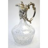 A Continental cut glass claret jug with rococo style collar, cover and handle, stamped 925