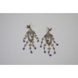 A pair of antique long drop chandelier earrings, the diamond and amethyst set quatrefoil with long