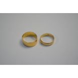 An 18ct yellow gold wide wedding band, size U, approx 6.6g to/w a 9ct yellow gold wedding band, size