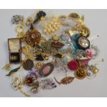 A collection of vintage and later costume jewellery including brooches, earrings, necklaces etc