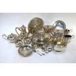 A quantity of electroplated wares, including two Victorian tea pots and other tea wares, entree dish