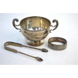 An Edwardian Irish silver sugar basin with twin scroll handles and stemmed foot, maker SIW (not
