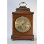 A Victorian walnut cased mantel clock, the 8-day French two train movement striking the hours on a