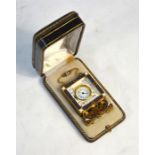 An early 20th century Continental small gilt metal and enamel strut-clock with bevelled glass over