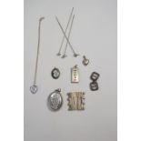 A collection of silver and white metal items including three Charles Horner hat pins, ingot, two