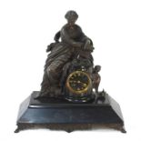 A substantial French brown bronzed patinated spelter figural slate mounted slate mantel clock, the