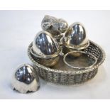 A Victorian electroplated cruet set modelled as a basket of eggs surmounted by a chick, Mappin &