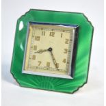 An Art Deco strut clock with green basse-taille enamelled silver surround, Goldsmiths & Silversmiths
