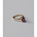 A 9ct yellow gold ring set with a single claw set oval amethyst, size N, approx 2.5g all in