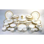 Royal Doulton 'Royal Gold' dinner and tea service, comprising:  Thirteen x 27 cm plates, twelve 20