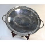 A late Victorian large oval epns wine tray with engraved decoration and armorial within reeded rim