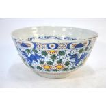 An 18th century Delft polychrome punch bowl, painted to the interior with birds on branches above