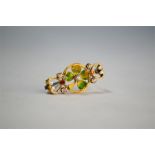 WITHDRAWN An Edwardian yellow gold and polychrome enamel shamrock brooch set with five small