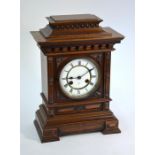 Late 19th century walnut cased bracket clock, the two train movement striking on a spiral gong,
