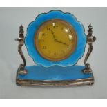An Art Deco silver and basse-taille blue enamel boudoir clock with gilt and enamel bezel, swinging