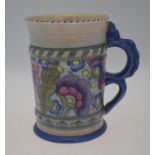 A Charlotte Reid Crown Ducal over-sized tankard with double loop handle, decorated in the