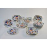 An early 19th century English bone china dessert service, possibly Spode, decorated in a Chinoiserie