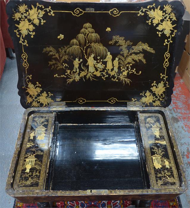 A Victorian gilt decorated black lacquered table with hinged top enclosing two lidded wells flanking - Image 3 of 3