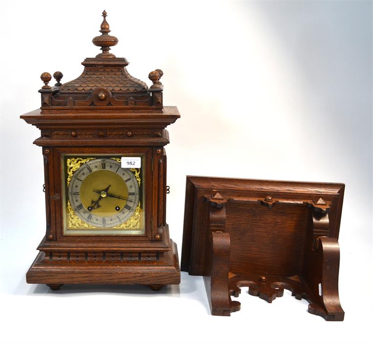 A 19th century oak German carved oak bracket clock by Winterhalder and Hofmeier, eight-day movement,