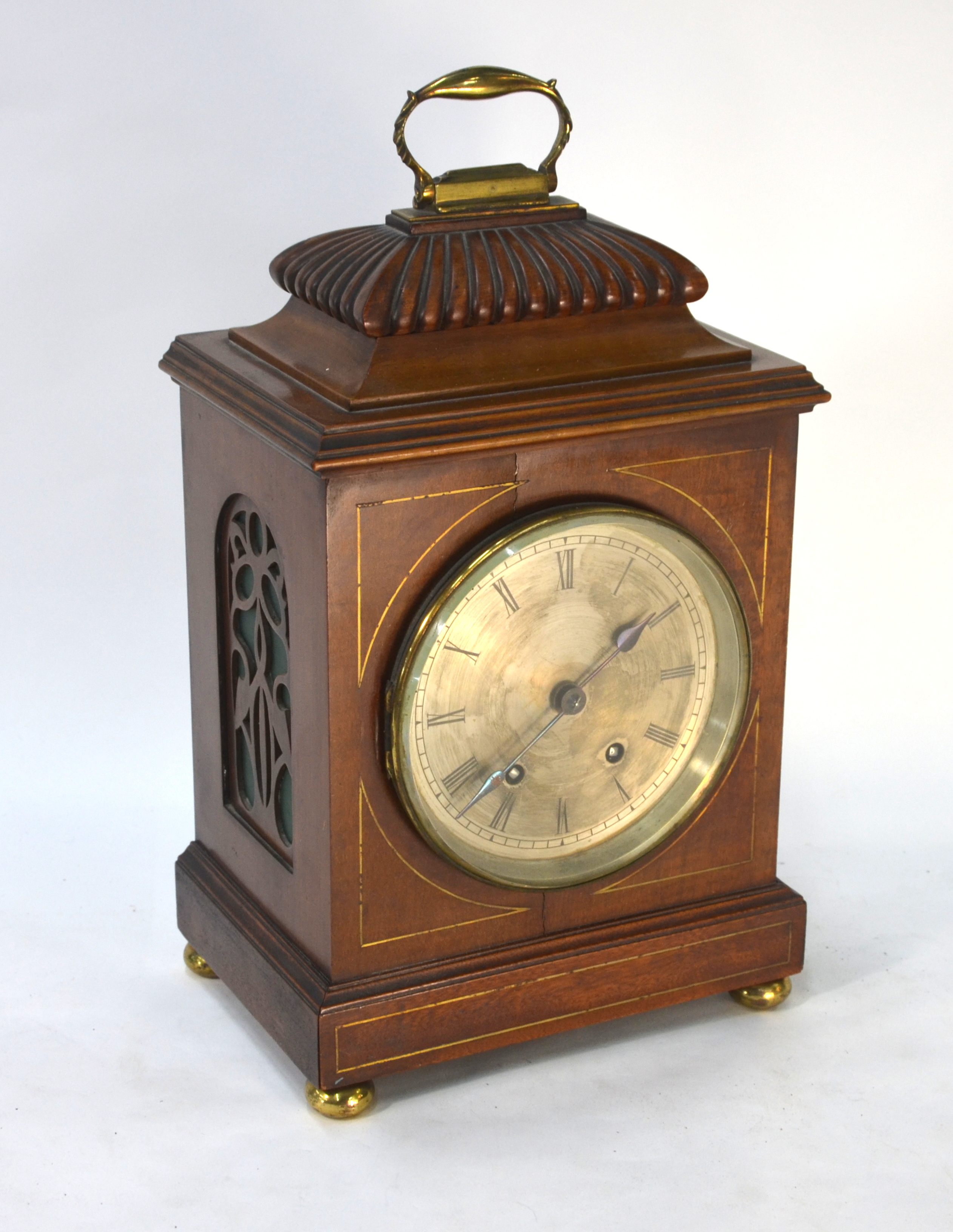 A Victorian walnut cased mantel clock, the 8-day French two train movement striking the hours on a