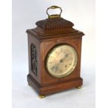 A Victorian walnut cased mantel clock, the 8-day French two train movement striking the hours on a