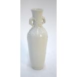 A Chinese Blanc-de-Chine style vase decorated with a prunus spray in high relief, 23 cm high Some