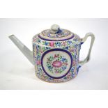 A Chinese famille rose teapot with a circular cover and finial; decorated predominantly in green,