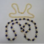 A row of uniform cultured pearls with alternate spacers and blue beads to/w row of uniform