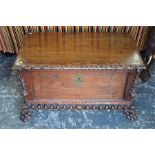 A 19th century continental oak wine cooler, the hinged top over a jointed panelled frame, raised