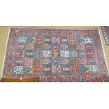 An old Persian Baktiari carpet, the all-over tile design on red/blue ground, 294 cm x 202 cm