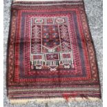 An Afghan Taimani Baluch prayer rug, circa 1920, the burgundy ground with multi borders and kelim