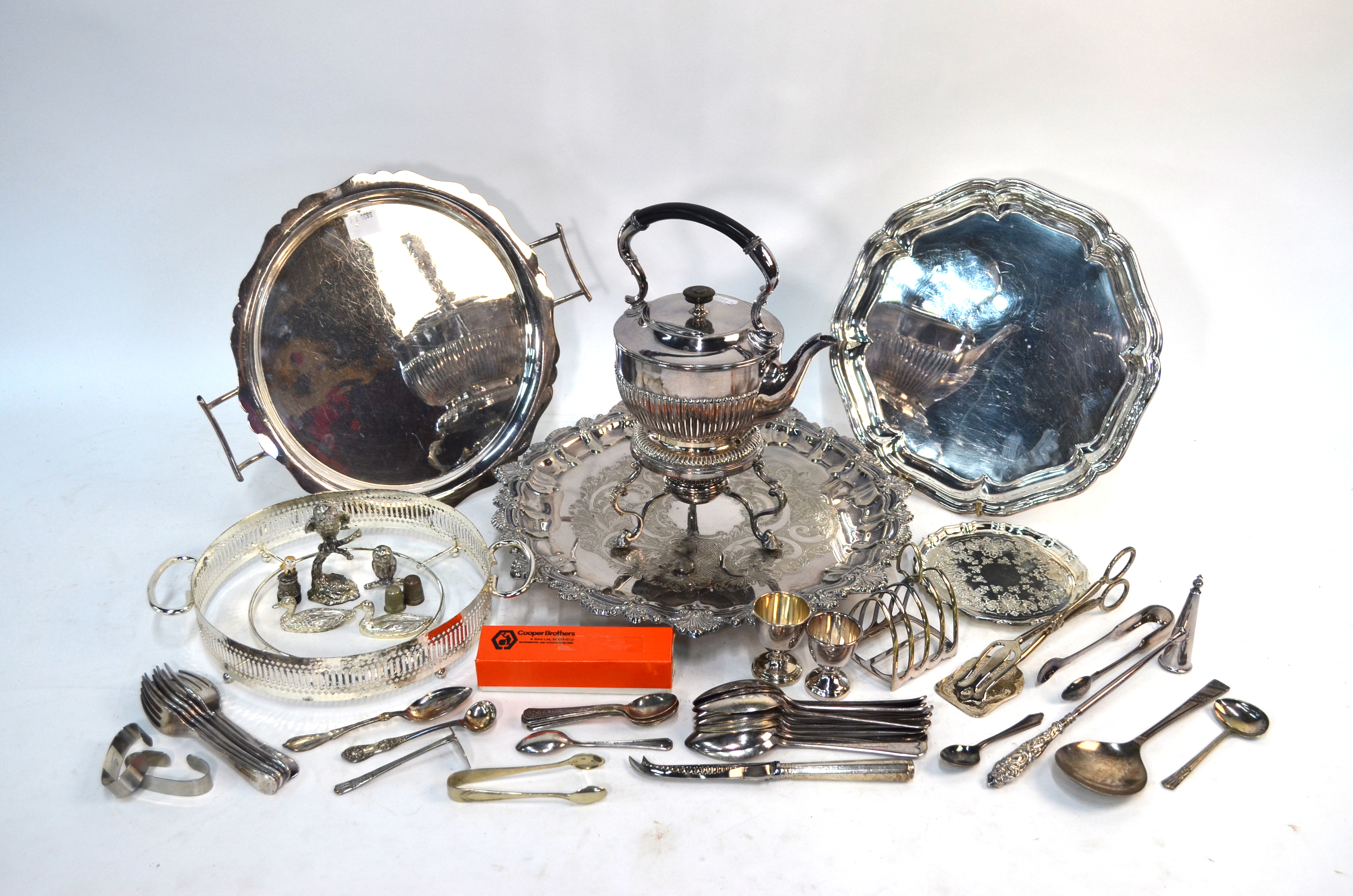 A box of mixed silver plate including engraved salver, tea kettle on stand, flatware, candle