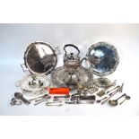 A box of mixed silver plate including engraved salver, tea kettle on stand, flatware, candle