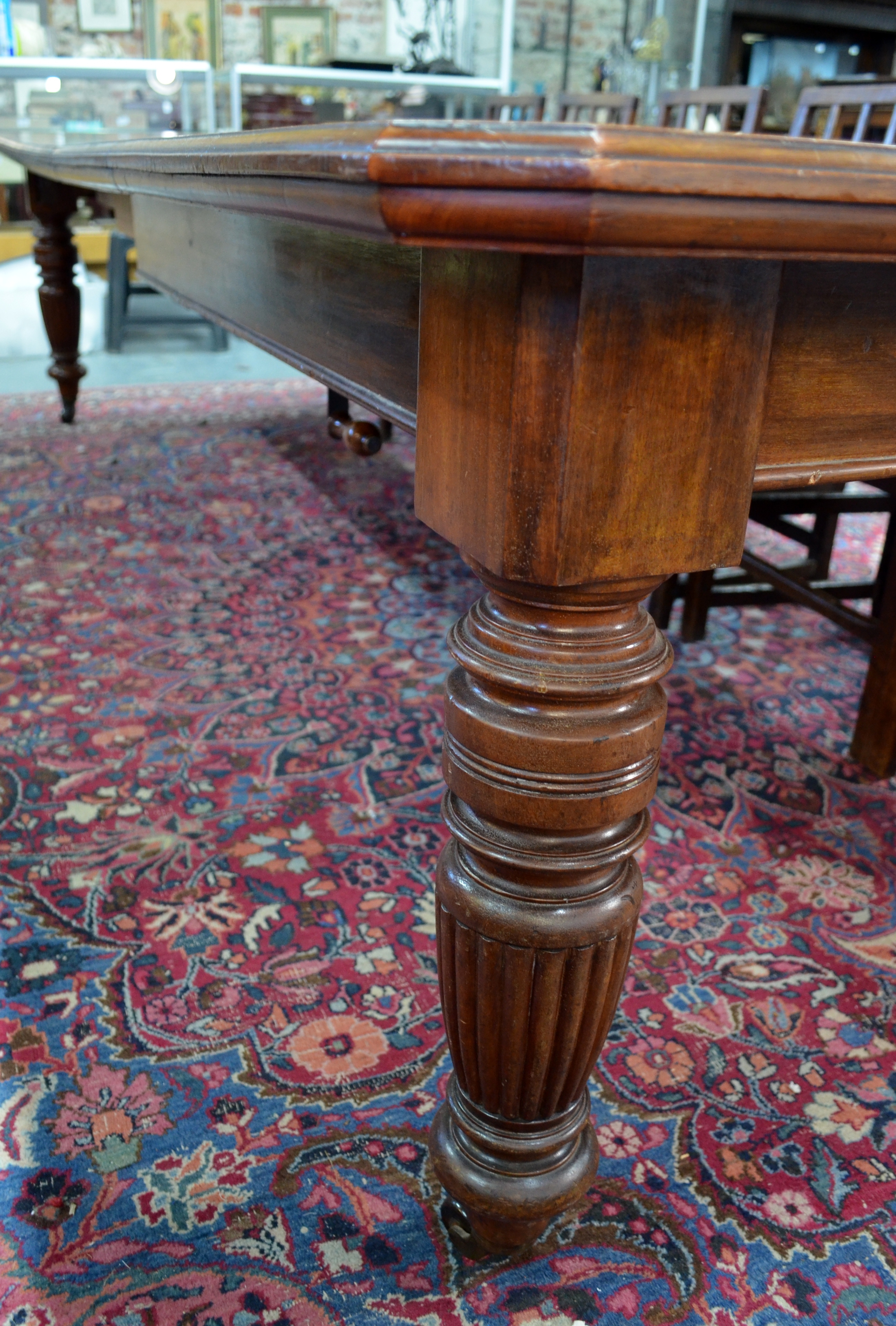A late 19th century mahogany extending dining table, the rectangular top with moulded edges and - Image 7 of 8