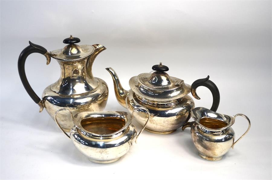 A heavy quality silver four-piece service including hot water jug, Viners Ltd., Sheffield 1932, 57