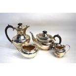 A heavy quality silver four-piece service including hot water jug, Viners Ltd., Sheffield 1932, 57