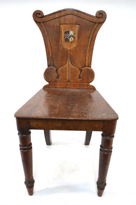 A Victorian mahogany hall chair, the moulded shaped back centred with a polychrome armorial raised - Image 2 of 2