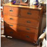 A Victorian teak two-part secretaire campaign chest with two short over three long drawers, the
