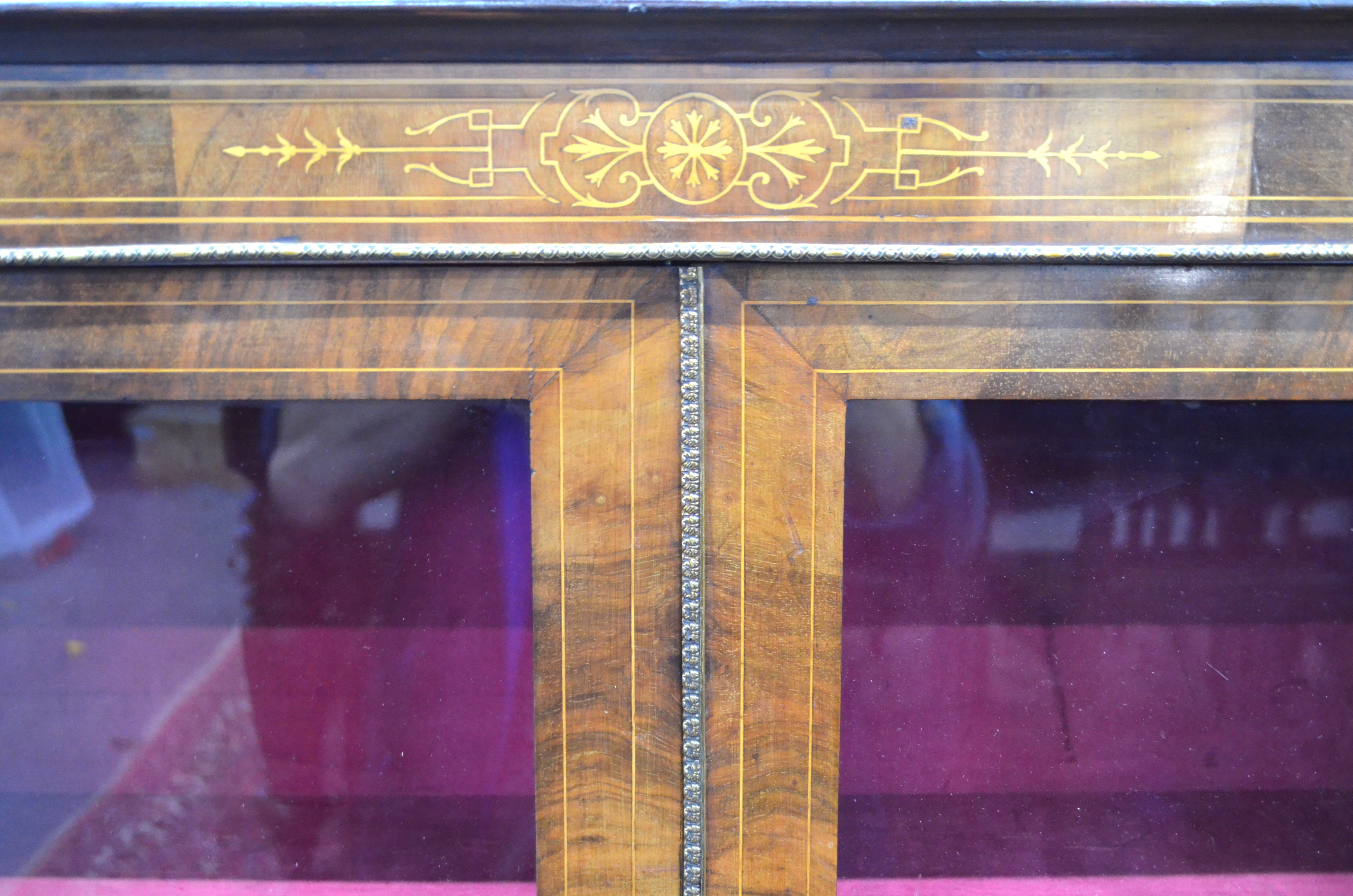 A Victorian satinwood inlaid mahogany cabinet with gilt metal mounts, the two glazed doors opening - Image 2 of 2