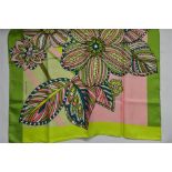 An Egon Von Furstenberg silk scarf with bold flower print in vibrant green/pink/turquoise, a silk