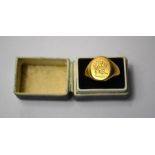 An 18ct yellow gold gentleman's signet ring with engraved crest, size P, approx 12.3g