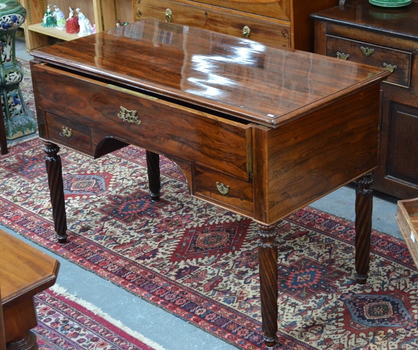 A 19th continental rosewood campaign desk, the top sliding to reveal a hinged front secretaire