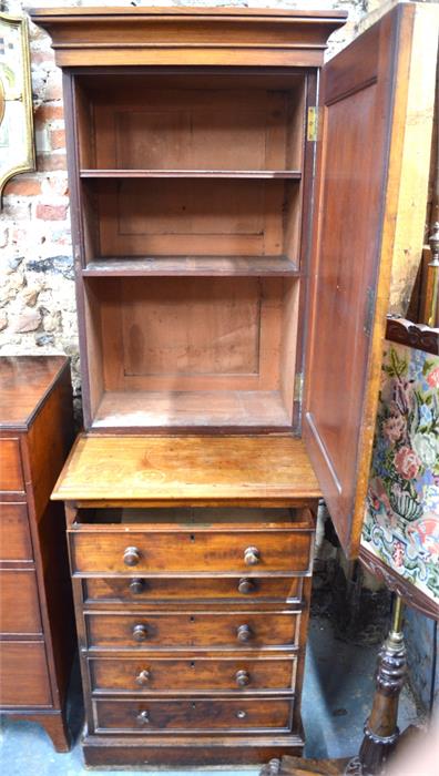 A Victorian mahogany cabinet over five long even drawers with turned wood pulls, on a plinth base,
