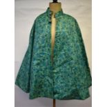 Miss Mayfair, 16 The Square, Winchester - A 1960s floral turquoise/green textured PVC cape with pale